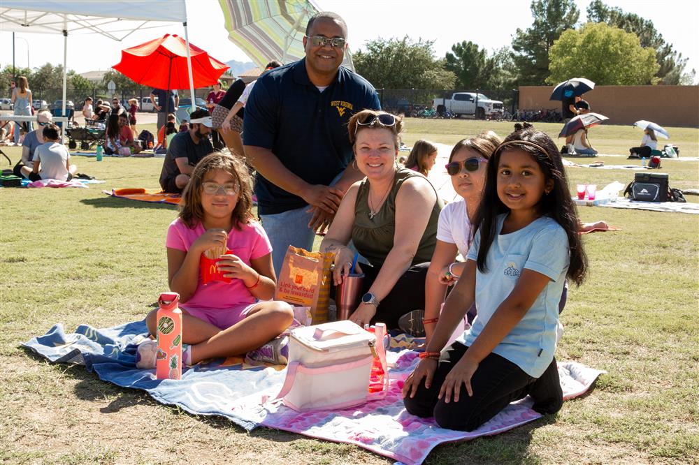 Families visit students during lunch and play games.